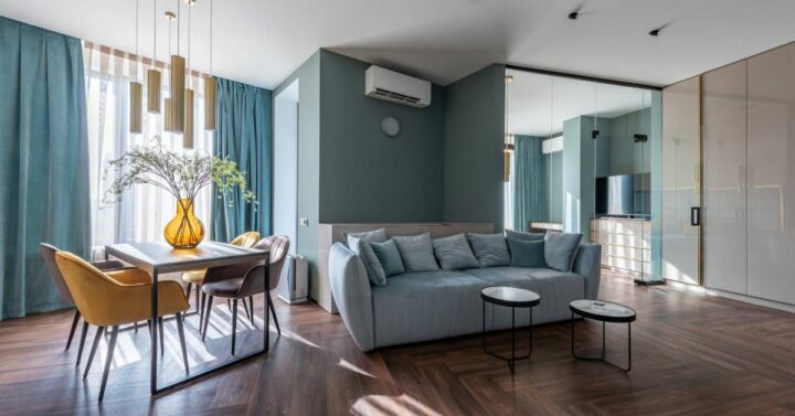 Interior of spacious living room with minimalist furniture.