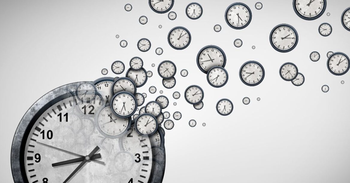 One large clock face in the lower left of the image with small clocks breaking off toward the top right all showing different times as to indicate time tracking.