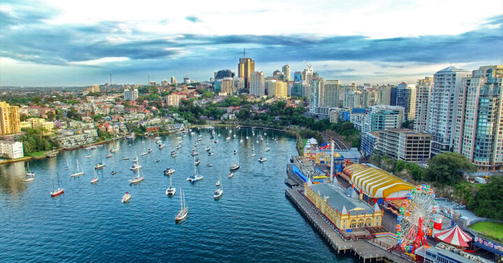 View of Sydney showing a harbour bay with many yachts and waterfront properties